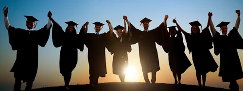 Decorative Image: graduates holding hands, arms raised in celebration