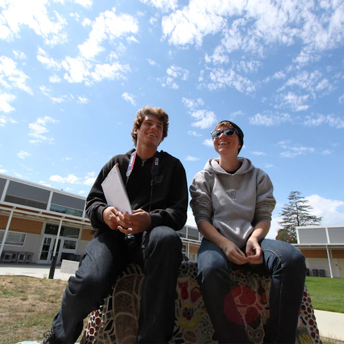 Smiling students outside