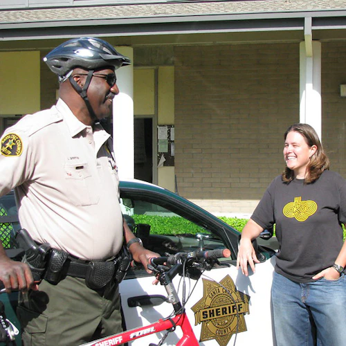 campus police officer with student