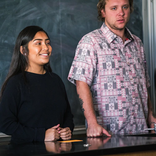 female and male in a classroom