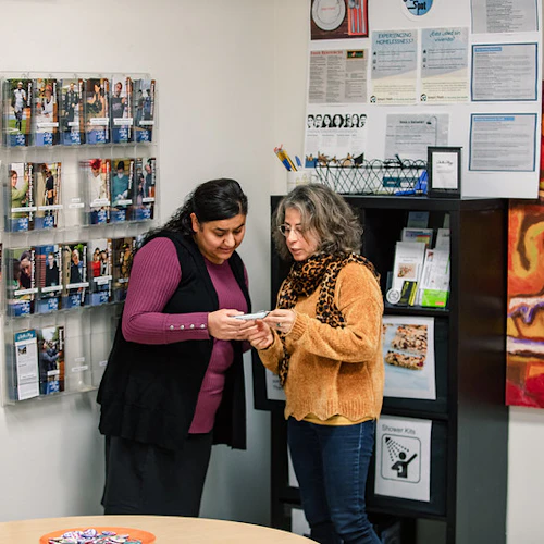 A female instructor discusing program options with a student.