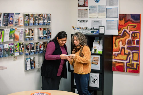 A female instructor discusing program options with a student.