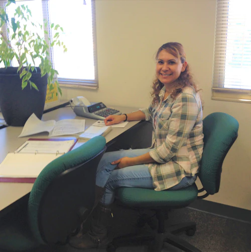 female student sitting in the computer lab