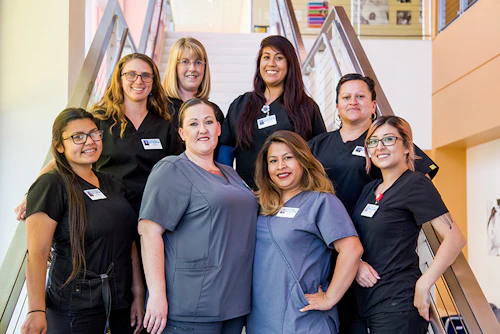 team of students on the clinic steps