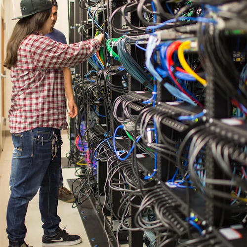Cabrillo College CIS Student working in a server room