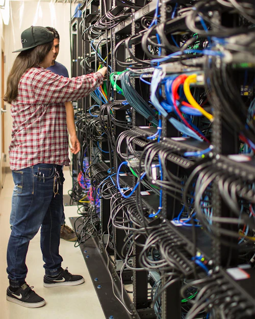 Cabrillo College CIS Student working in a server room