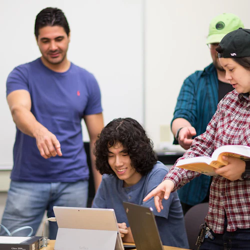 Cabrillo College Computer Information Systems Students Collaborating around a computer