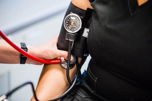 blood pressure gauge on an arm