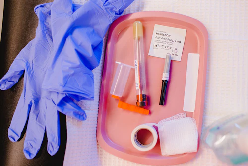 latex gloves with medical tape and gauze