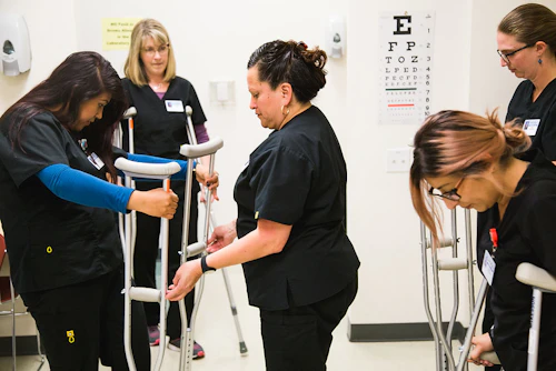 Students learning to use crutches