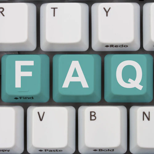 The letters FAQ on a keyboard in teal