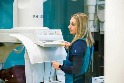Student working with an xray machine