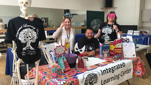 three people and info table
