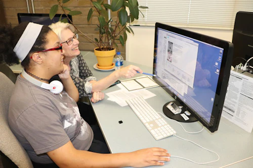 Instructor correcting student's work