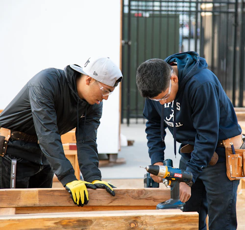 male construction students framing a floor