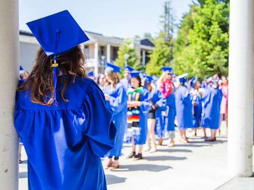 graduating student facing away