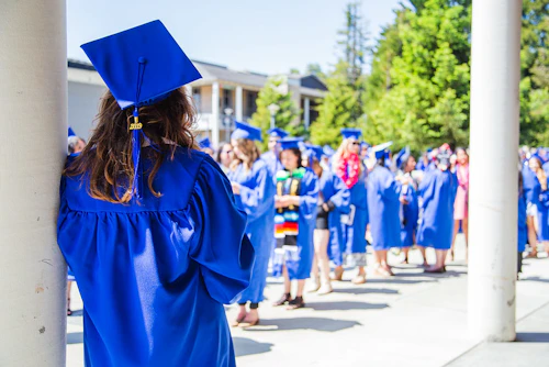 graduating student facing away