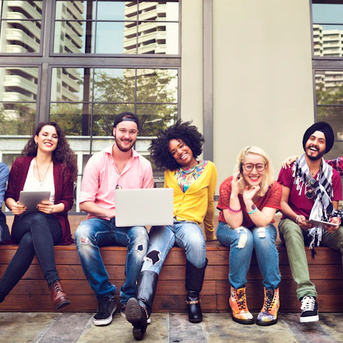 A group of diverse students sitting on a bench