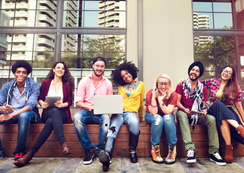 A group of diverse students sitting on a bench