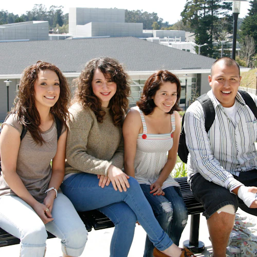 Smiling students on bench