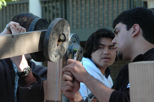 students working on physics assignment outside