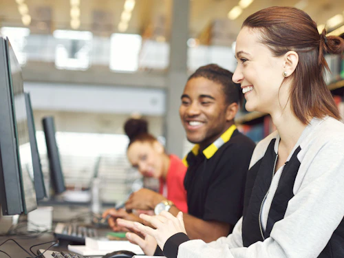 Students Smiling at Computer Lab