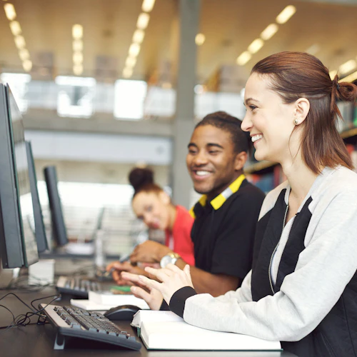Students Smiling at Computer Lab