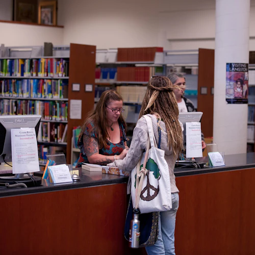 Librarian with student