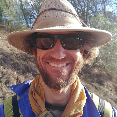 Portrait with scarf and sunglasses.