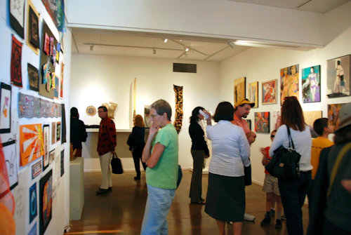 patrons looking at art gallery