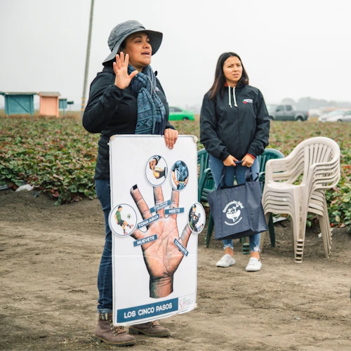Community Health Workers talking with a group of people