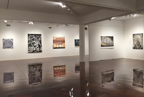 Installation view of large scale prints of skeletal built structures