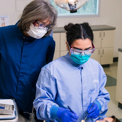 student working on a patient