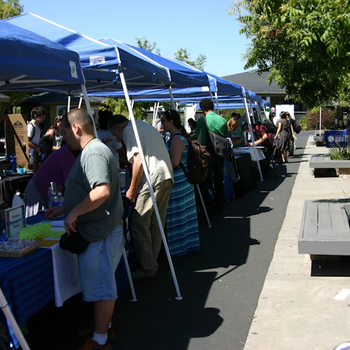 students being helped at tents outside