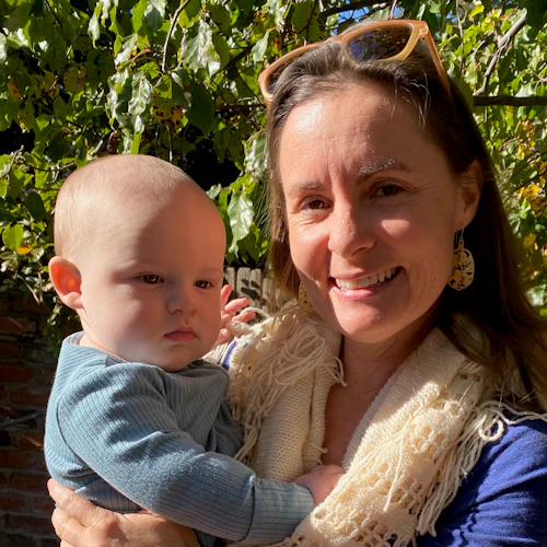 Emily holding an infant