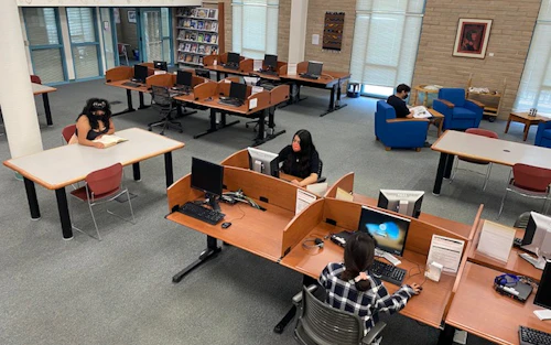 Students seated in the Aptos campus library
