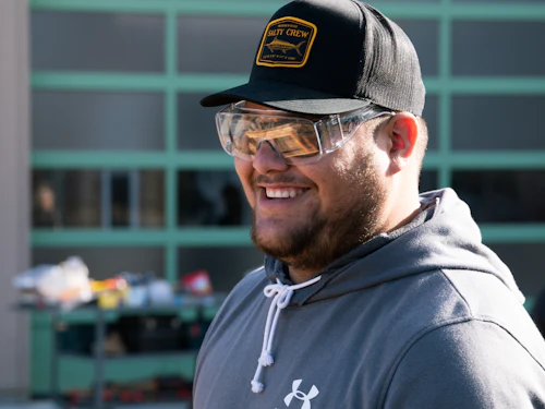 student wearing a cap and goggles at the Wats Center