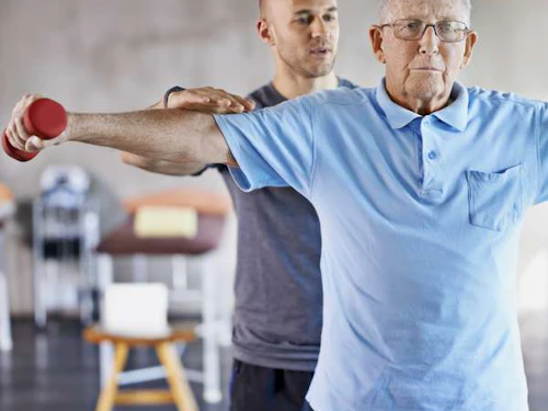 Physical Therapist working with a patient