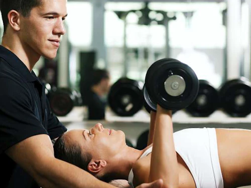 athletic trainer with a client