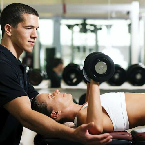athletic trainer with a client