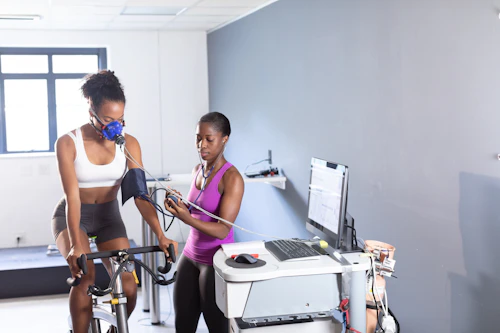 Exercise Physiologist doing exercise testing with a female athlete