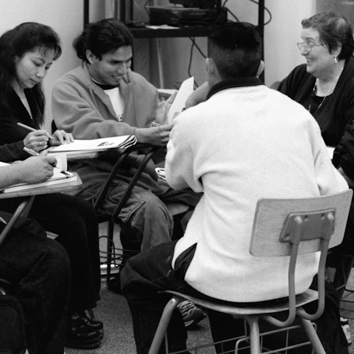group of students sitting in circle working together