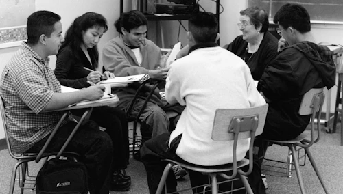 group of students sitting in circle working together
