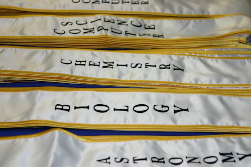 STEM majors printed on graduation stoles