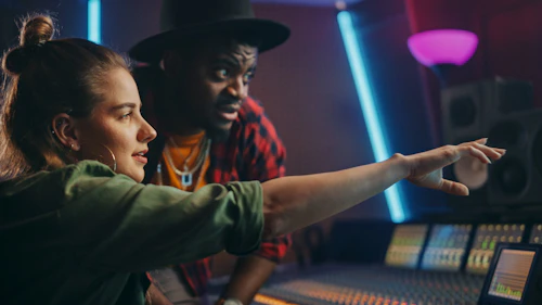 female and male audio producers