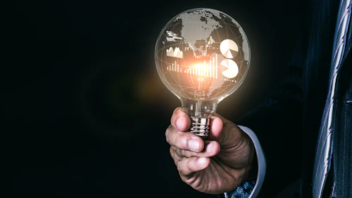 a hand holding a lightbulb