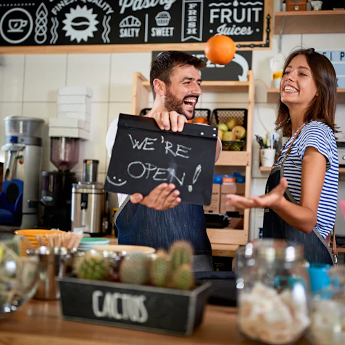 male and female business owners at their grand opening