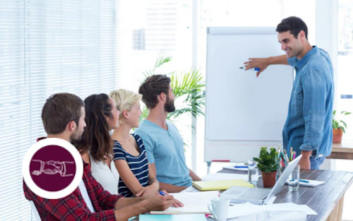 a person presenting at a white board