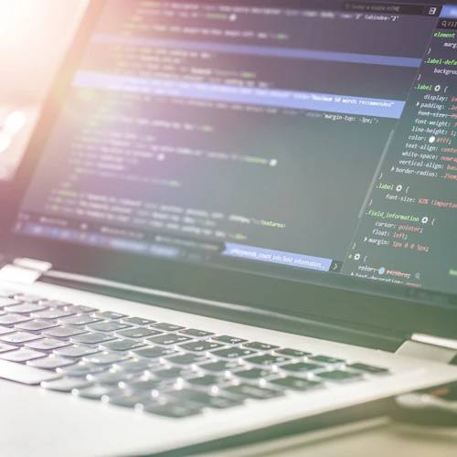 laptop with code on the screen