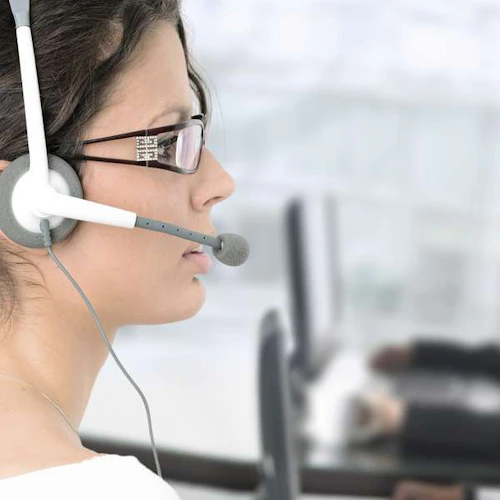 female emergency dispatcher wearing a headset
